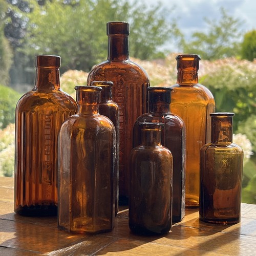 Amber vintage glass bottles - amber,