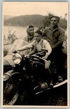 39891341 - Man with wife and son on a BMW with sidecar motorcycle