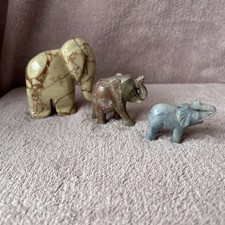 three hand-carved marble