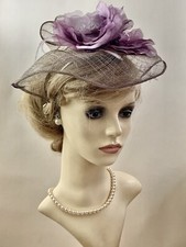 Dusky Lilac Sinamay Fascinator With Double Rosette Detail On A Metal Headband.