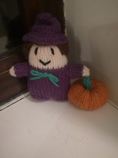 Small, knitted, Halloween Witch with Orange Pumpkin