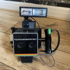 VINTAGE POLAROID INSTANT MINIPORTRAIT CAMERA. MODEL 301