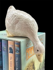 Vintage ceramic duck and goose figurine leaning over edge shelf kitchen decor