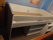 Single bed with shelves and storage underneath