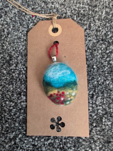 Needle felted pendant a - of,