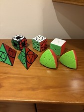 Assortment Of 7 Rubix Cube