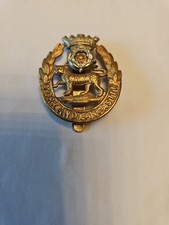 This is a cap badge for the York and Lancaster Regiment, British Army infantry