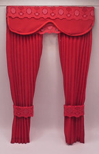 Dolls house curtains.  Red