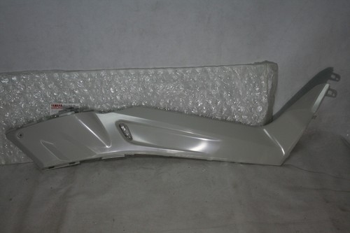 Under footrest panel right - under,