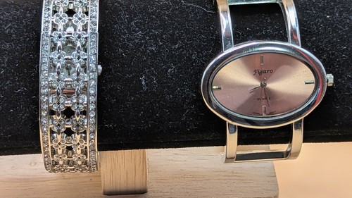 Two ladies bangle watches