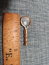 Brass miniature magnifier with