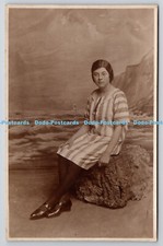 R756556 Woman Sits on the Rock Vieler 29 Seaside Road Eastbourne