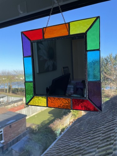 Mirror with rainbow coloured - with,