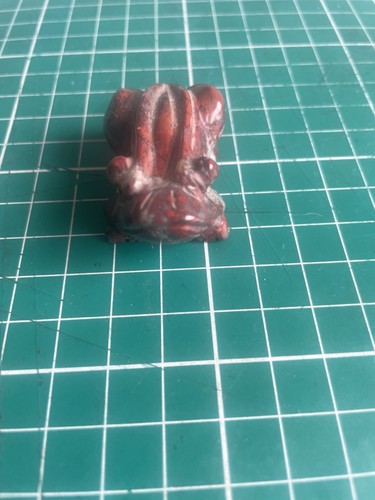 Red model frog in - red, a