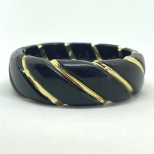 Wide black and gold plastic