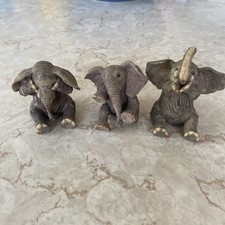 Three Ceramic Elephants In The