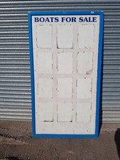 boats for sale sign boatyard