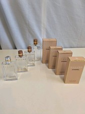 Four Empty Chanel Allure Perfume Bottles With Boxes
