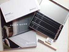 Set 12 graphite pencils in tin, with putty rubber, pencil extender & paper guide