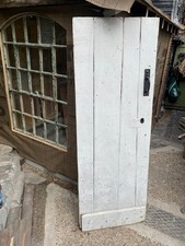 Antique painted pine tongue and groove panelled door
