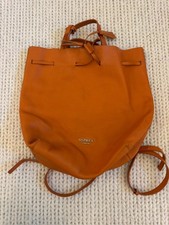Osprey leather backpack handbag in orange leather with silver lining. Drawstring