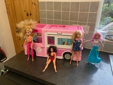 Barbie Camper Van with dolls and extras.