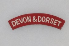 BRITISH ARMY CLOTH SHOULDER TITLE DEVON & DORSET REGIMENT