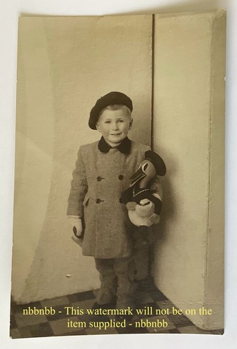 Photograph boy with an - of,