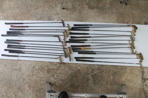 Twenty six brass head putters - six,