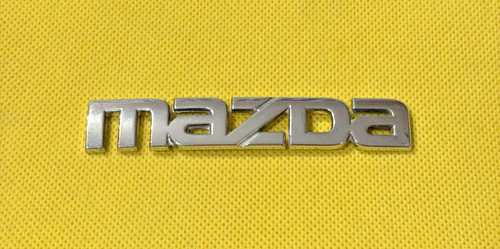 Mazda car badge emblem - car,