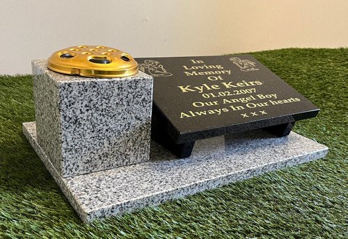 Memorial stone and flower - stone,