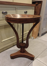 Antique inlaid revolving mahogany circular side table