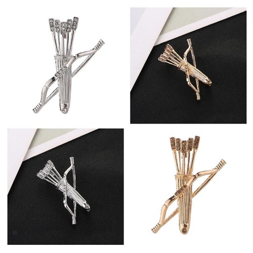 Metal brooch with - , bow