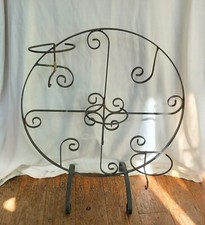 Vintage round black scrolled