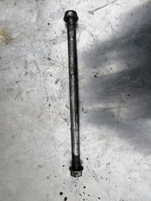 Swingarm spindle axle for a