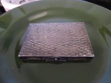 Silver colour powder compact
