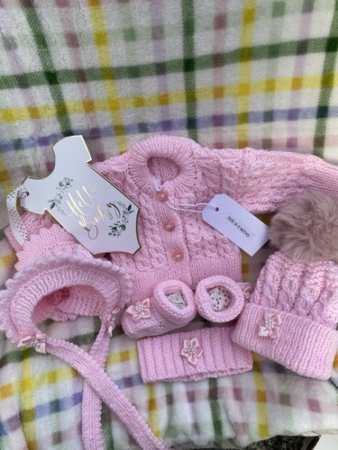 Hand knitted pink baby - hand,