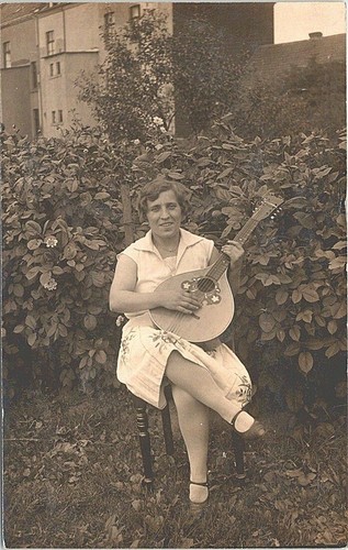 Rppc european woman playing - european,