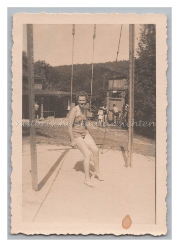 Woman swimsuit sitting on - in,