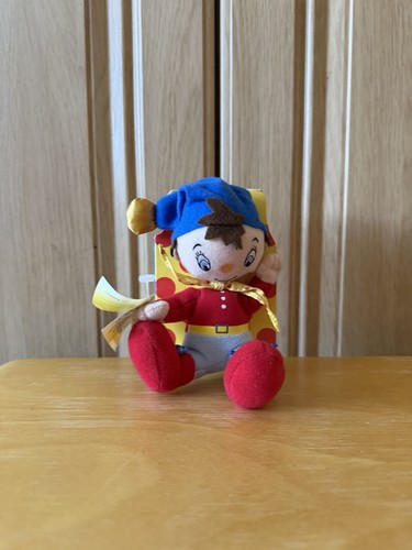 Noddy doll with - with, book