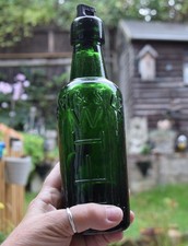 R.W & S WHITE ltd , dark green bottle Circa 1890, with original stopper.