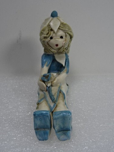 Seated pottery figure a - seated,