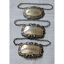 Three sterling silver decanter