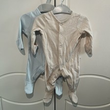 Two Newborn Baby Grows. One