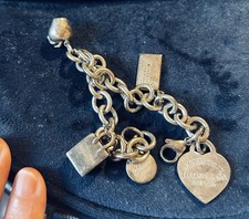 Tiffany &Co silver bracelet,  4 charms rare design 