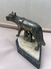 bronze sculpture depicting a she-wolf suckling the mythical founders of Rome