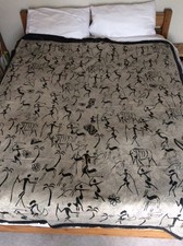 Screen printed grey black African "Cave Art" motif fabric piece