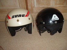 Two vintage open face helmets