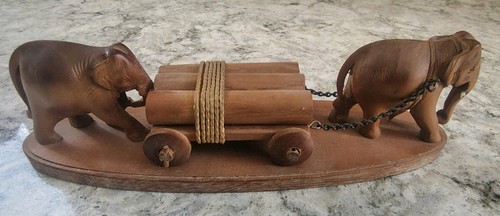 Elephants with logs wooden - with,