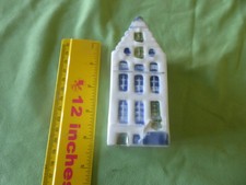 A CERAMIC MODEL OF A HAND PAINTED DUTCH HOUSE